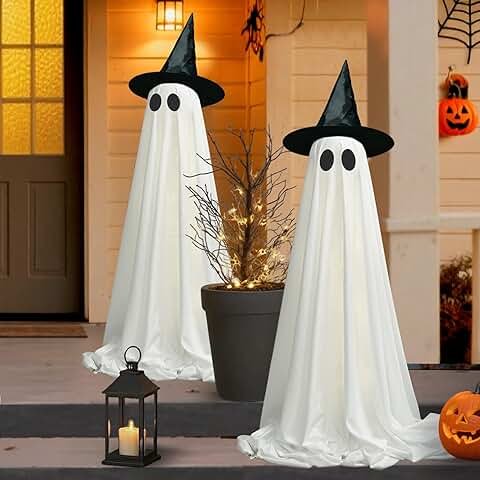 Ultimate ghostly Halloween decorations outside a house with hanging ghosts, glowing skeletons, and fog creating a spooky festive atmosphere